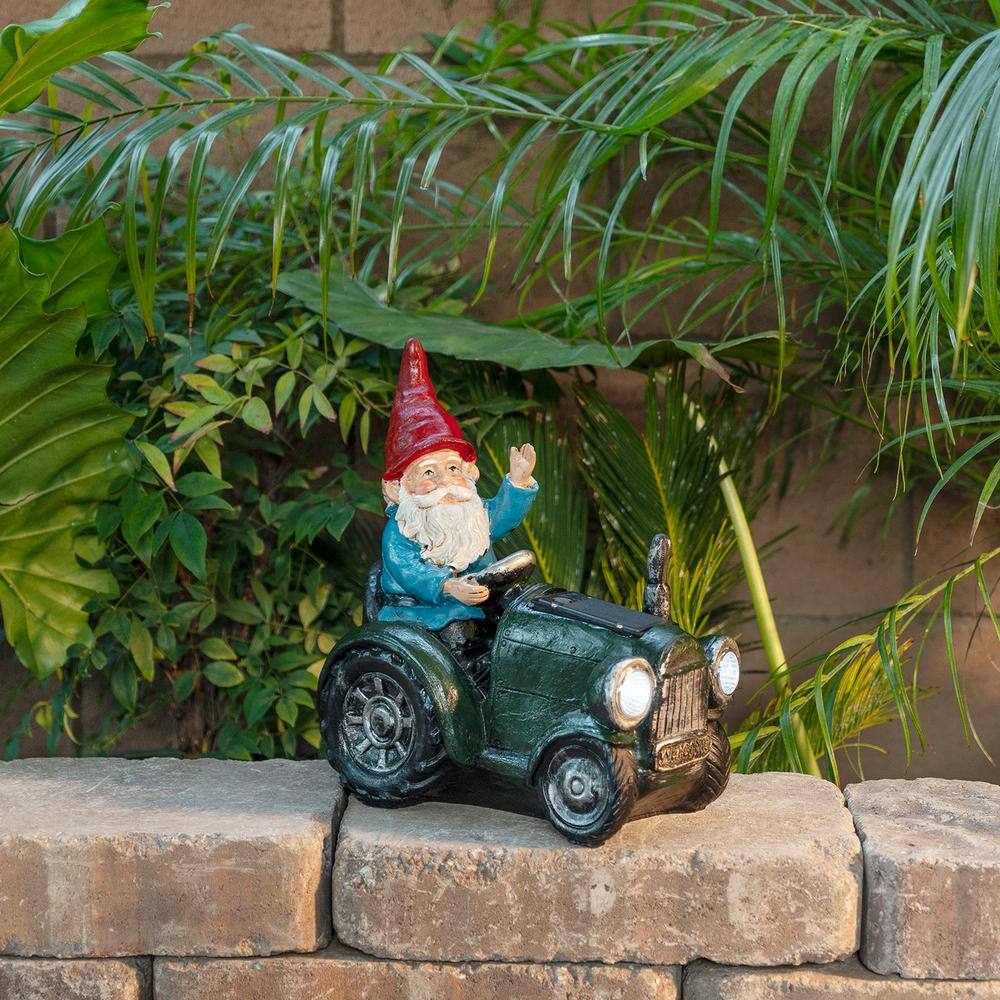 Alpine Corporation 10 in. Tall Outdoor Garden Gnome Riding Green Tractor Yard Statue Decoration with LED Lights, Multicolor