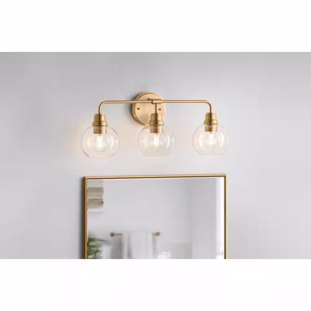 Hampton Bay Florabelle 24 in. W 3-Light Vanity Light Antique Gold Clear Globe Glass Shades