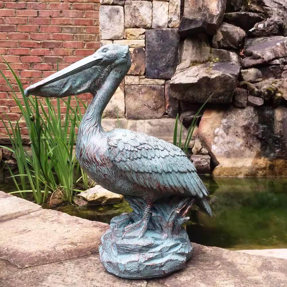 HOMESTYLES 20 in. Pelican on Coastal Rock Collectible Beach Statue