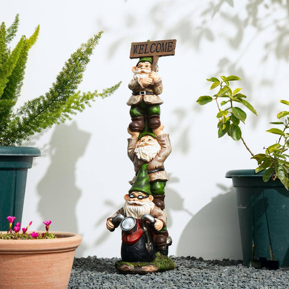 Glitzhome 25.5 in. H Outdoor Polyresin Stacked Riding Gnome Garden Statue with Solar Light