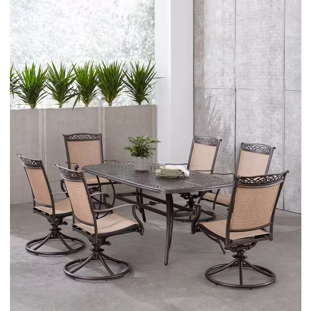 Hanover Fontana 7-Piece Aluminum Outdoor Dining Set with 6 Sling Swivel Rockers and a 38 in. x 72 in. Cast-Top Table