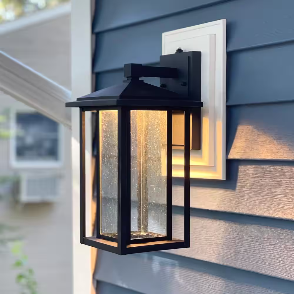 Maxxima 1-Light Black LED Outdoor Wall Lantern Sconce with Seeded Glass and Dusk to Dawn Sensor