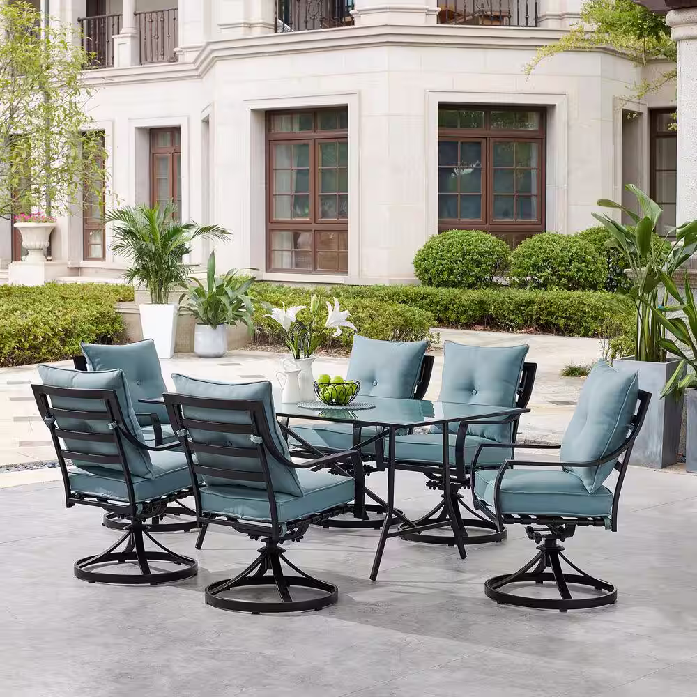 Hanover Lavallette 7-Piece Steel Outdoor Dining Set with Ocean Blues Cushions, Swivel Rockers and a Glass-Top Table