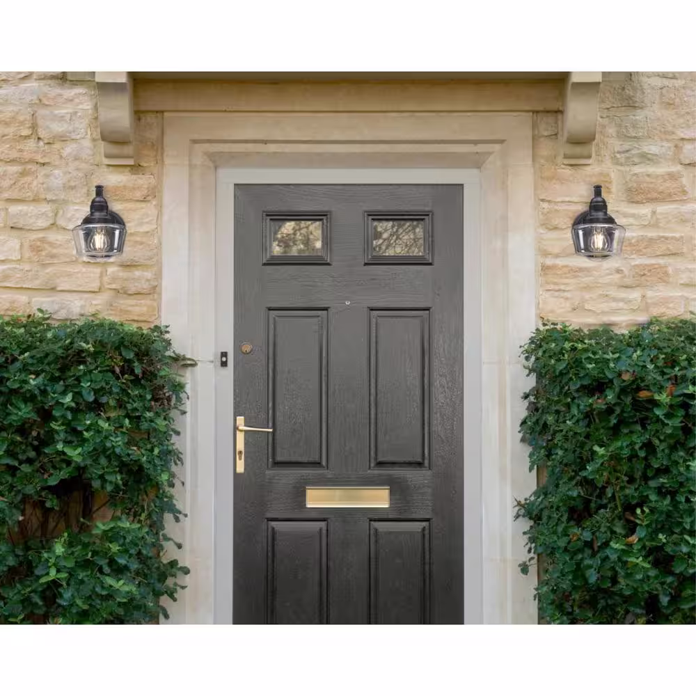 Westinghouse Eddystone 1-Light Matte Black Outdoor Wall Mount Sconce with Clear Seeded Glass, Dusk to Dawn Sensor