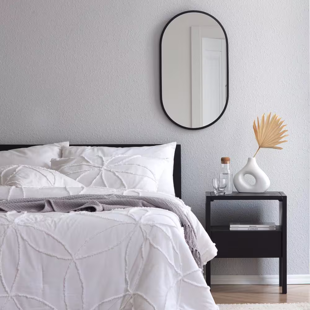 Habitat 16 in. W x 28 in. H Pluto Oval Frameless Black Modern Mirror
